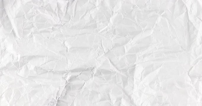 Stop motion video footage with the blank white crumpled and creased paper, infinitely changing poster texture background