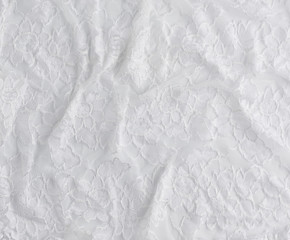 texture of crumpled white synthetic fabric guipure for sewing