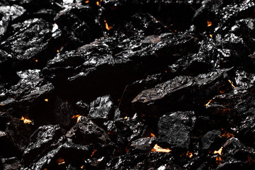 Black charcoal texture, red-hot natural mineral resource background