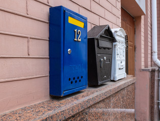 Beautiful mailboxes on a beige brick wall