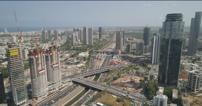 Tel Aviv highway road at daytime. Aerial drone view above Ayalon car roads with traffic in the middle of Modern city in Israel