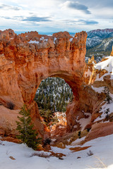 Hole in a rock cliff forming an arch Bryce Canyon Utah
