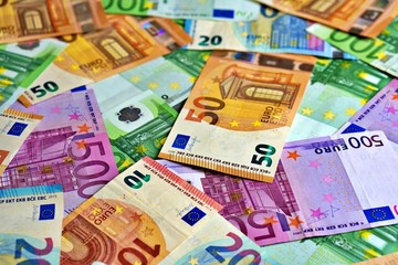 United country's payment system - euro money cash background, pile of paper euro banknotes.