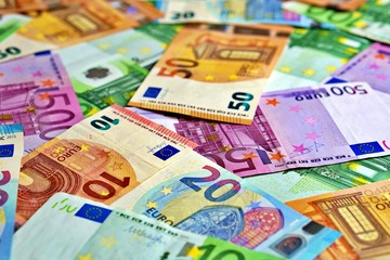 United country's payment system - euro money cash background, pile of paper euro banknotes.