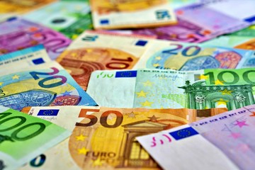 United country's payment system - euro money cash background, pile of paper euro banknotes.