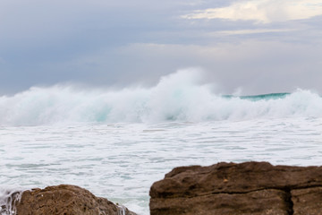 Ocean coast, moviment waves with foam.