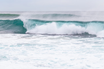 Ocean coast, moviment waves with foam.
