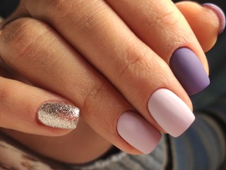 beautiful nail art manicure on the background of a fashionable texture