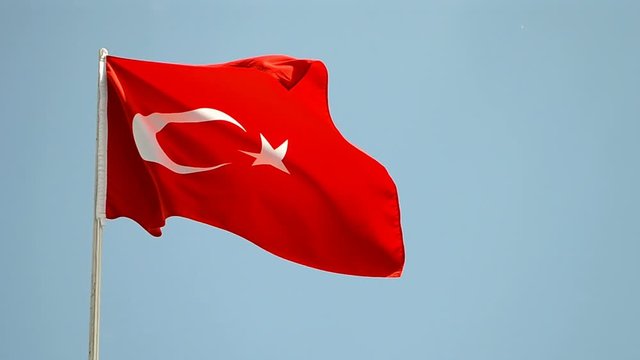 turkey travel diversity, turkish red flag on blue sky under wind in sunny day,.