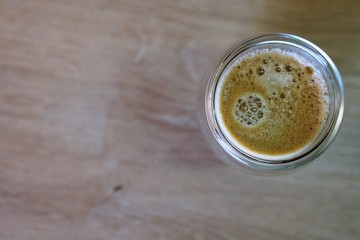 Coffee time in office. Capsule espresso in double glass cup - 100% arabica