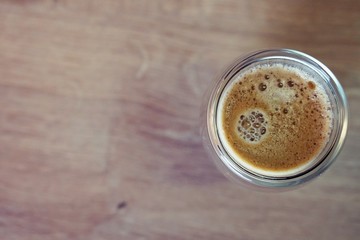 Coffee time in office. Capsule espresso in double glass cup - 100% arabica