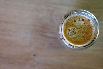 Coffee time in office. Capsule espresso in double glass cup - 100% arabica