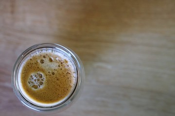 Coffee time in office. Capsule espresso in double glass cup - 100% arabica