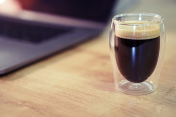 Coffee time in office. Capsule espresso in double glass cup - 100% arabica