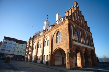 Kamień Pomorski, the old market square with the town hall building. - obrazy, fototapety, plakaty