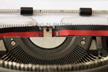 a typewriter with a sight inside the machine and a paper with the sentence 