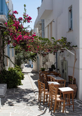View of a small taverna, set in a shaded alley on the Greek island of Paros.  Picture taken at the small fishing village of Piso Livadi. 