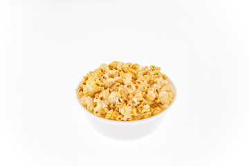 Close-up of popcorn in bowl on white background