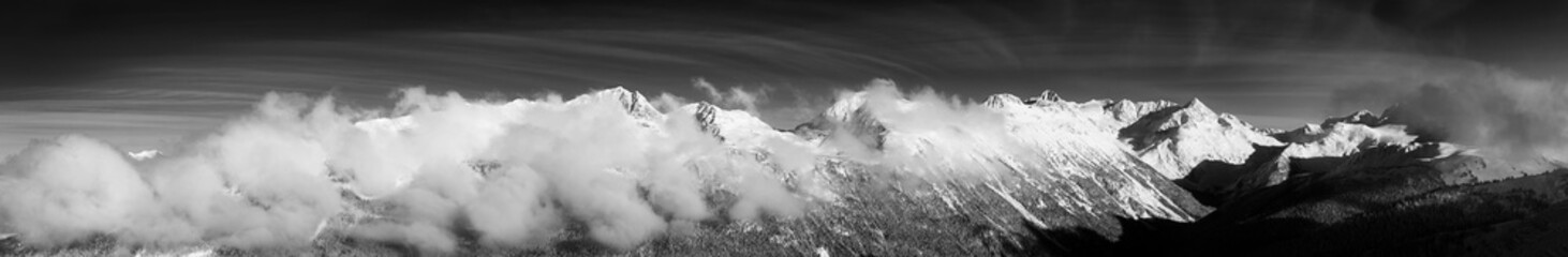 Black and White Artistic Render. Whistler, British Columbia, Canada. Beautiful View of the Canadian Snow Covered Landscape with Blackcomb Mountain in Background during a cloudy and sunny winter day.