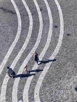 High angle view of family walking on street
