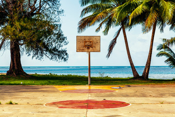 Basketball Court With Ocean and Palms in Background © maksymowicz