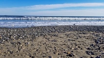 Waves roll in on quiet stretch of winter beach