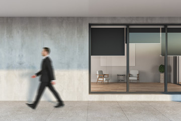 Businessman walking on street.