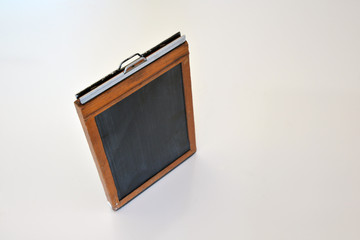 old 5x7 film holder on white background