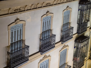 Windows of buildings in old cities of Spain