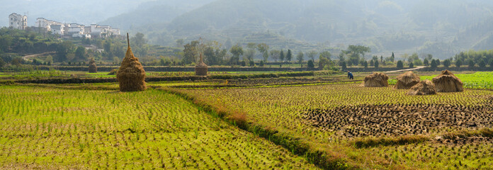 Panorama of Hilltop village and cultivated farm fields and hay stacks at Yanggancun village China