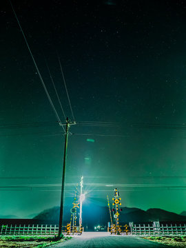 Illuminated Railroad Crossing At Night