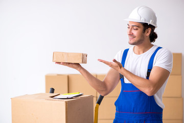 Young male professional mover doing home relocation