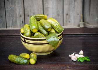 Organic canned cucumbers in a beautiful ceramic deep plate