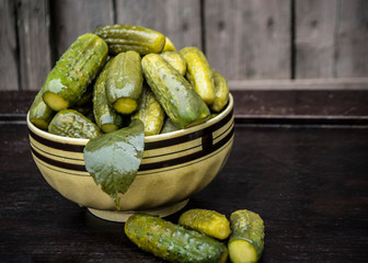Organic canned cucumbers in a beautiful ceramic deep plate