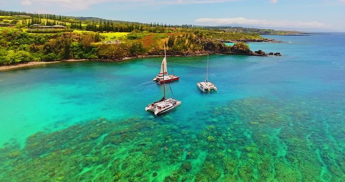 Maui surf images with catamarans