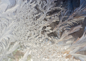 Beautiful frosty patterns on the window glass.
