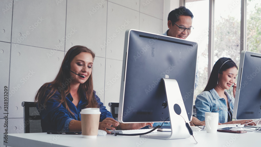 Aufkleber customer support agent or call center with headset works on desktop computer while supporting the cu