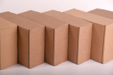 a row or wall of cardboard boxes