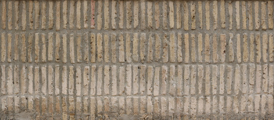 wall with vertical bricks - regular and well aligned bricks background
