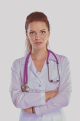 Portrait of young woman doctor with white coat standing in hospital . Portrait of young woman doctor