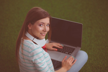 Young woman sitting a table in the kitchen. Young woman