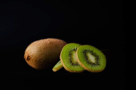 Sliced kiwi on a black background close-up