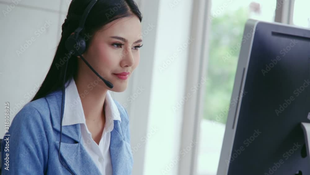 Aufkleber customer support agent or call center with headset works on desktop computer while supporting the cu