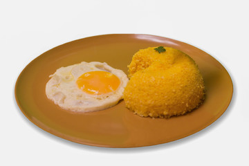 Pacman Cuscuz and egg - Traditional dish from northeastern Brazil. Cuscuz can be made from flour, corn, rice or cassava. White background.