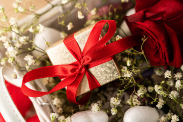 Close-up of wrapped Valentines day gift with gypsophila