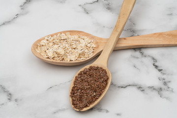 Seeds on a wooden spoon close up