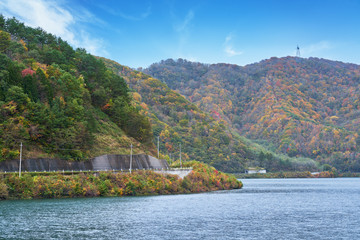 Fototapeta na wymiar landscape of autumn season of fukushima with ouchi dam and colorful mountain