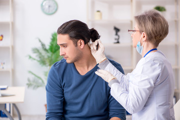 Fototapeta premium Young patient visiting doctor in hospital