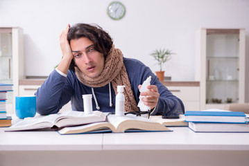 Sick male student suffering at home