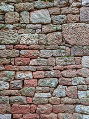 Red sand stone wall with moss